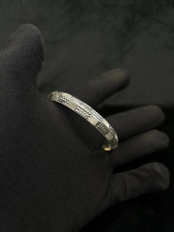Silver Valor: Engraved Majesty Bangle