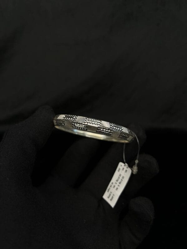Silver Valor: Engraved Majesty Bangle