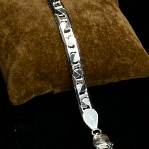 Sterling silver Figaro chain bracelet with a lobster clasp